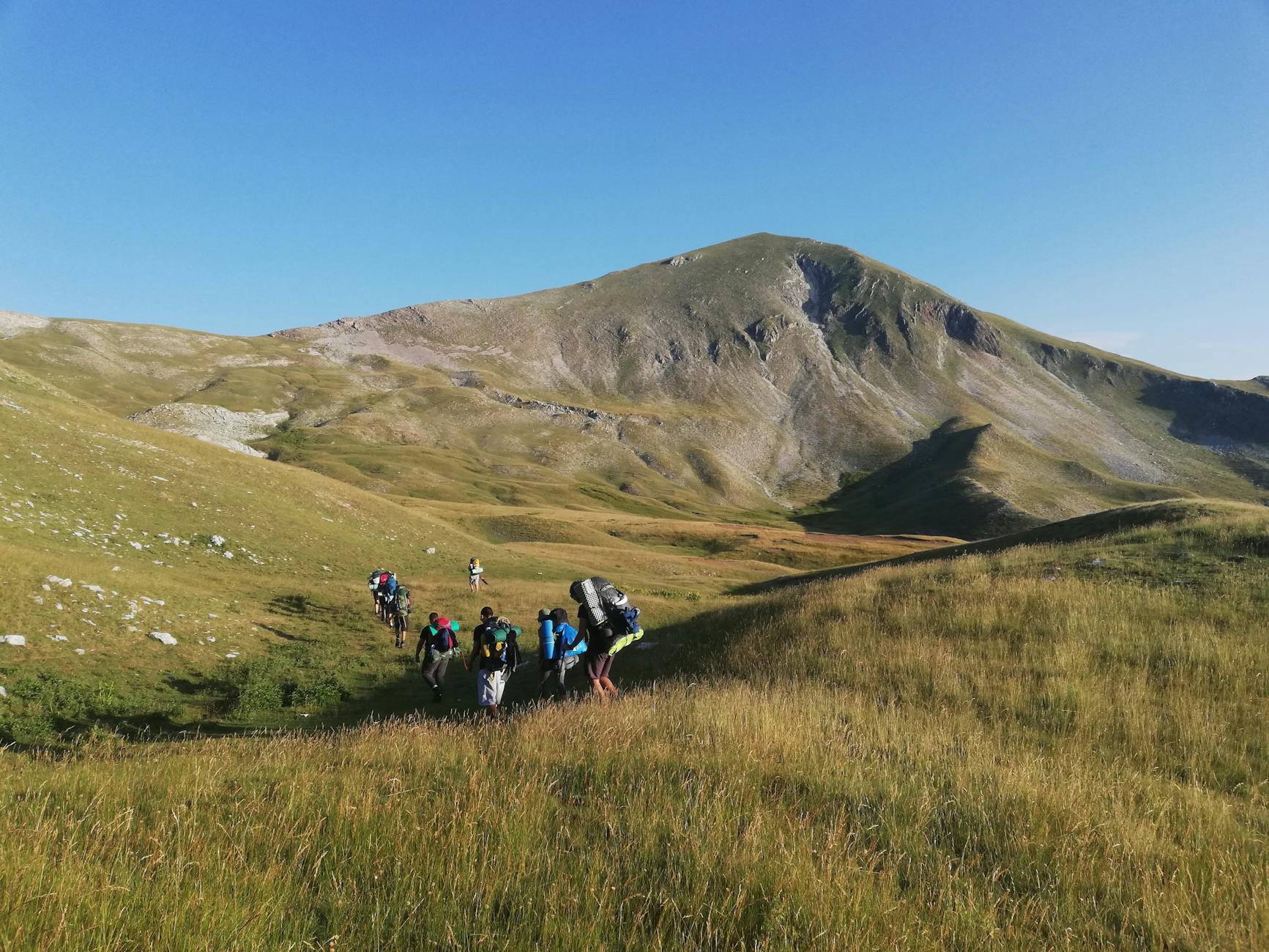 Group of travelers enjoying outdoor adventure activities in Kazakhstan wilderness